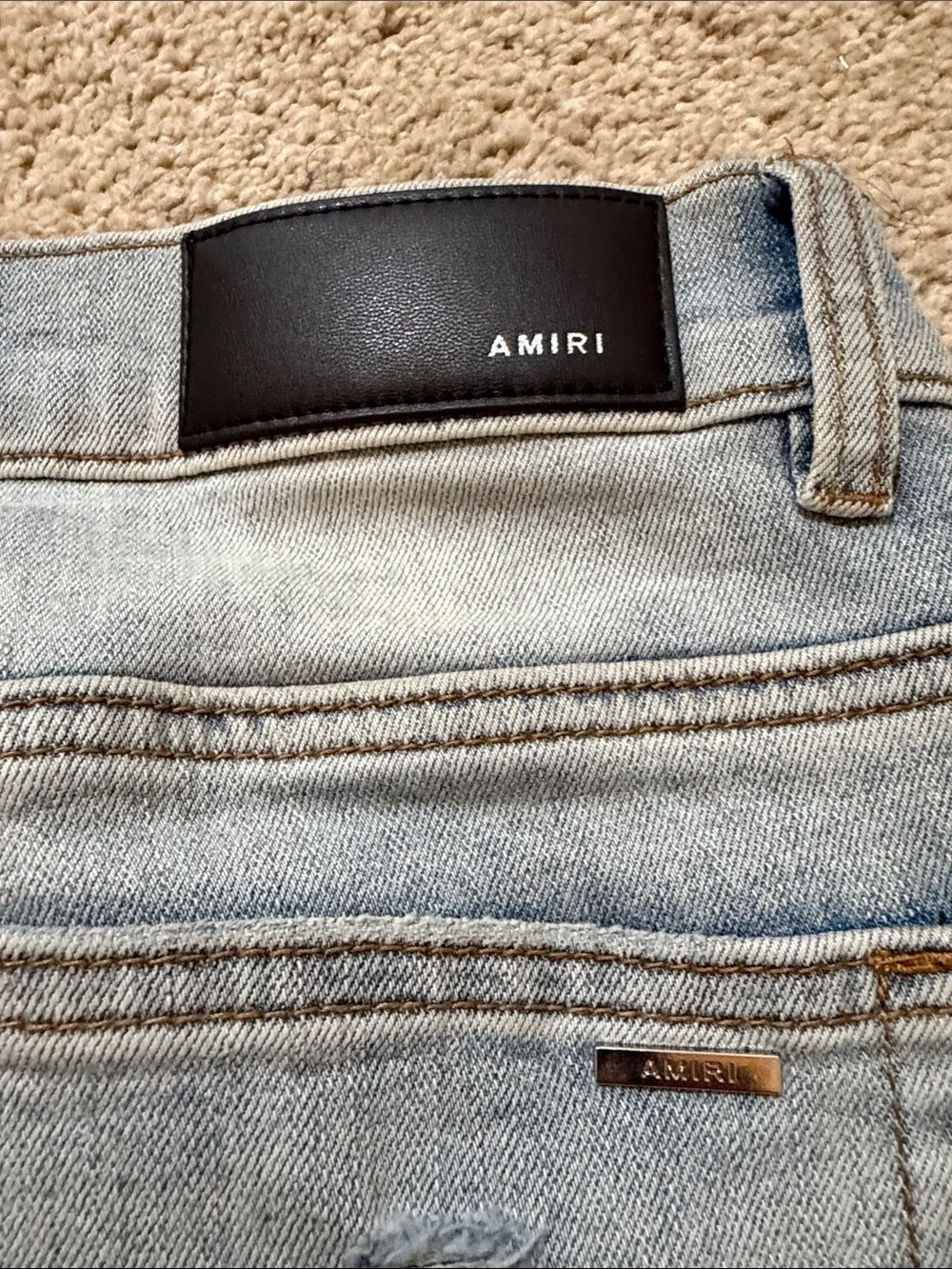 AMIRI Light Blue Slim Straight Jeans with Black Logo Patch